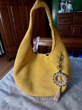 The Sak Yellow Crochet Hobo with Beaded Peace Charm